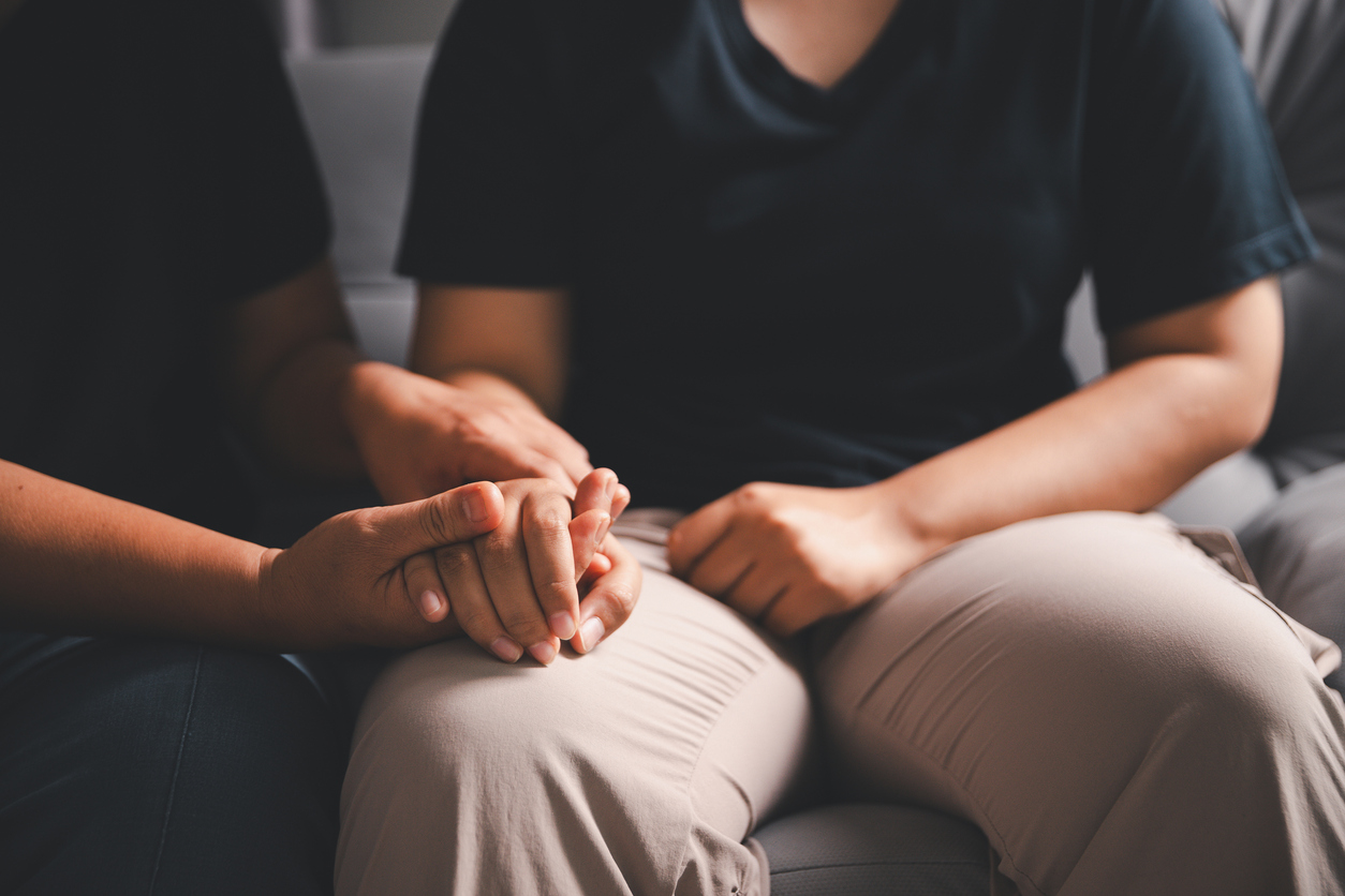 Hope and trust with crisis concept. Closeup, love and holding hands for support, comfort and care with grief, loss and empathy. people and family with compassion, sympathy and healing with bonding. Biohazard cleaning services in Ottawa, Kingston, and Smiths Falls,